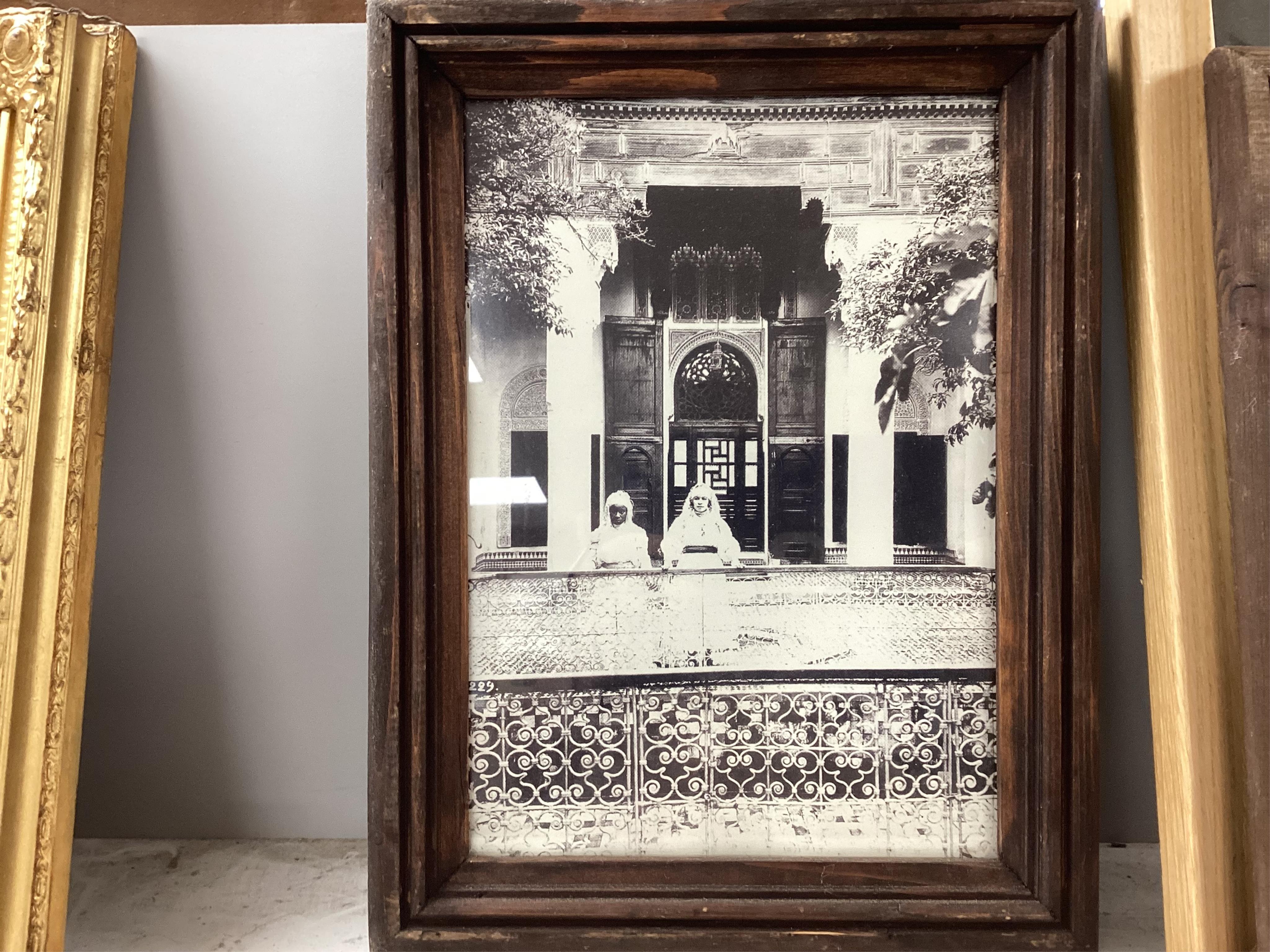 A set of four black and white photographs, Orientalist scenes to include pottery painting and a woman at a loom, 29 x 19cm, together with another